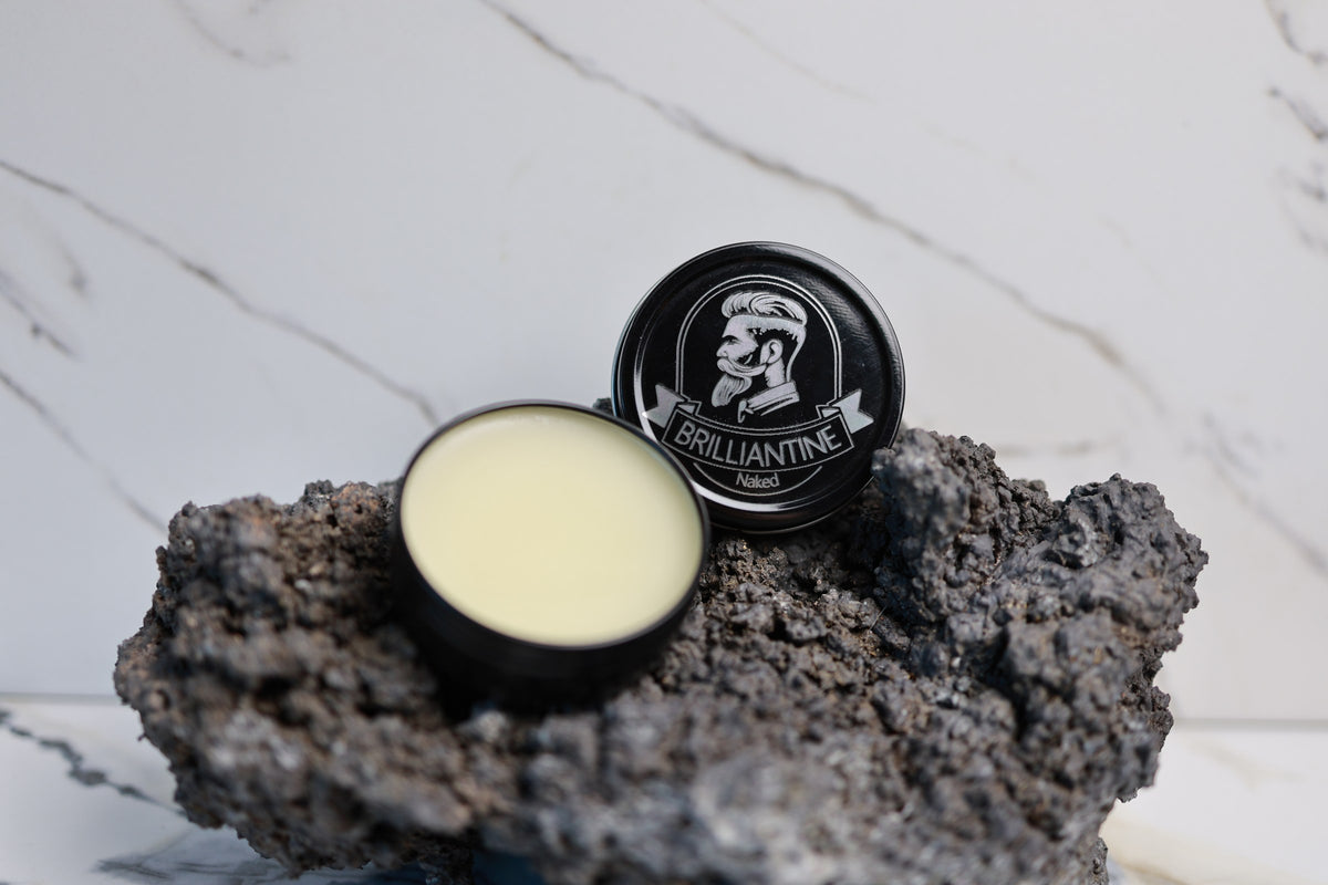 Brilliantine beard balm tin with the lid off showing the balm
