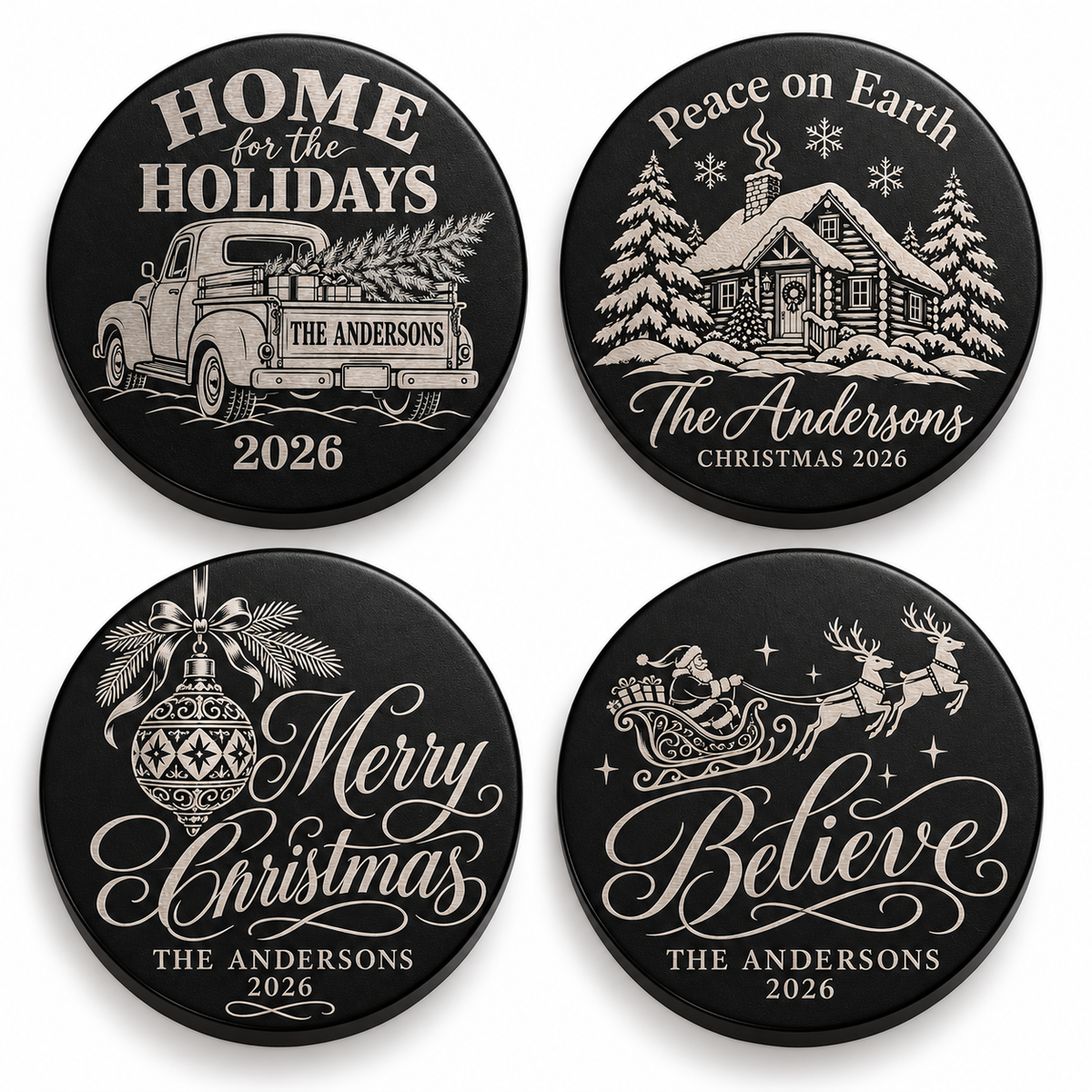 Four black candle lids engraved with christmas designs, shown together
