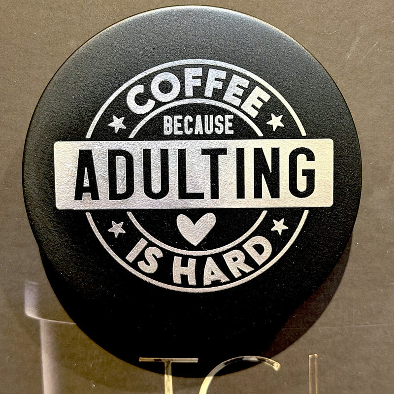 Black TGL candle lid engraved with Coffee Because Adulting Is Hard