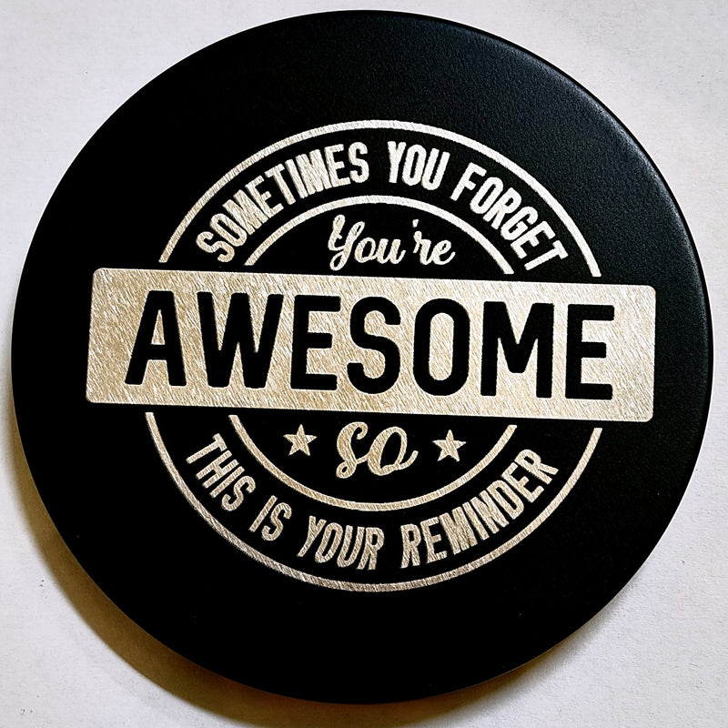 Black TGL candle lid engraved with the message Sometimes you forget you are awesome