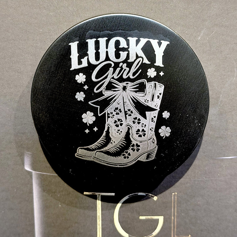 Black TGL candle lid engraved with Lucky Girl and a cowboy boot