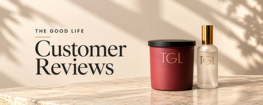 Customer Reviews banner with a red TGL candle and frosted TGL room spray on a marble counter