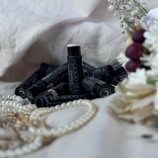 Natural beeswax lip balm with shea butter, mango butter, and coconut oil for deep hydration and repair. Smooth, non-greasy formula soothes dryness and protects lips