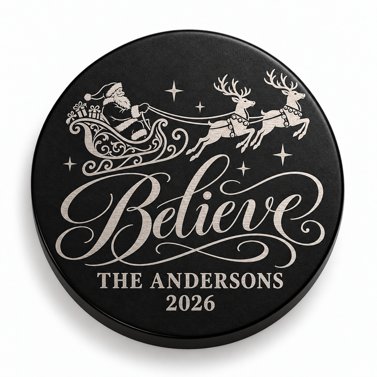 Black candle lid engraved with the Believe Sleigh christmas design