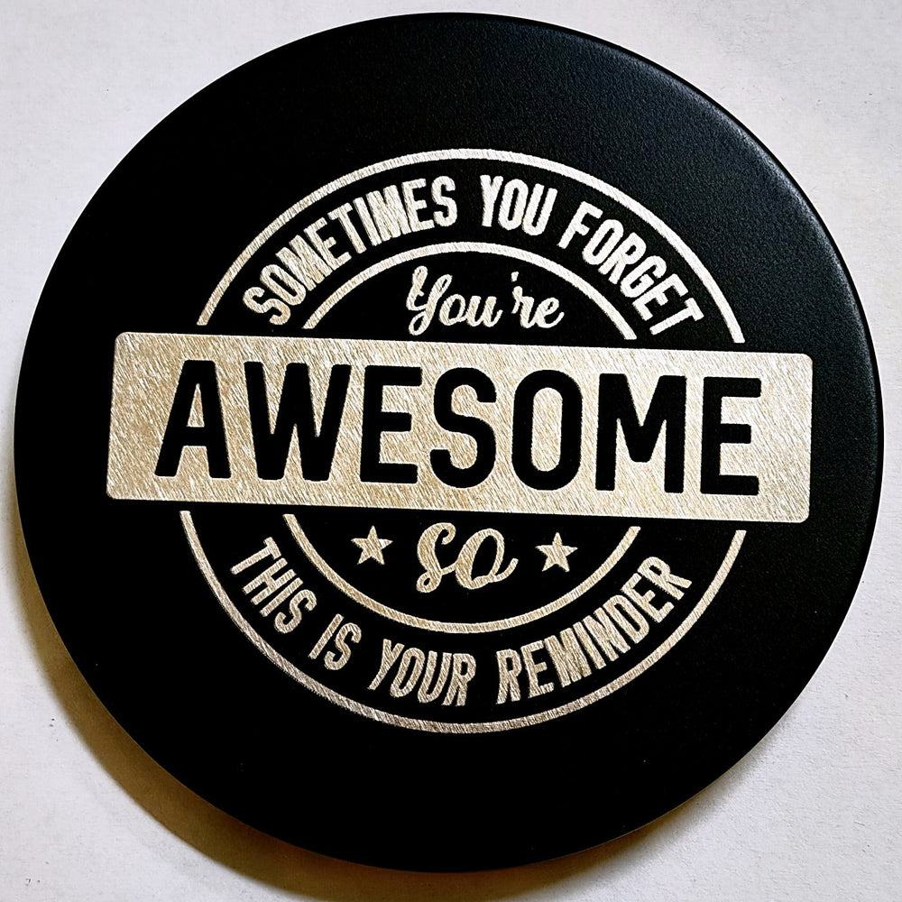 Black TGL candle lid engraved with a custom message
