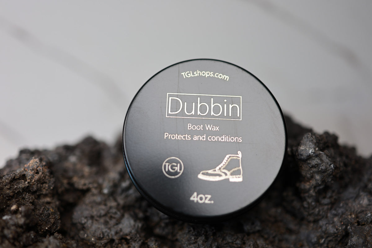 Dubbin beeswax boot wax 4 oz tin on lava rock