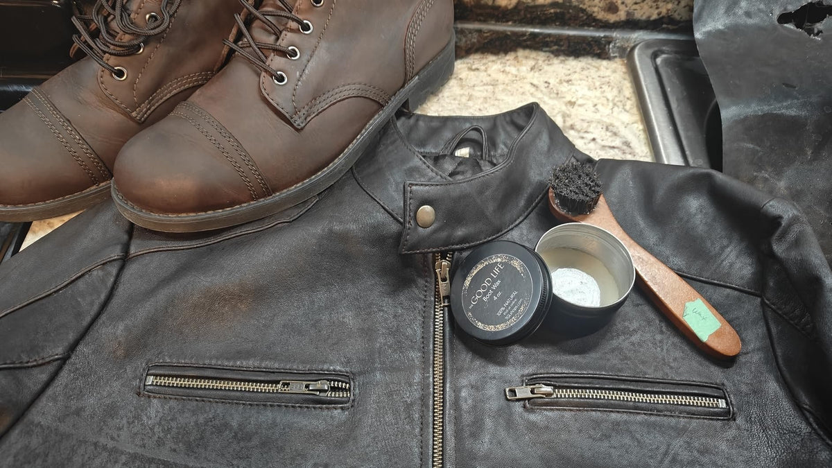 Dubbin boot wax with leather boots and a leather jacket